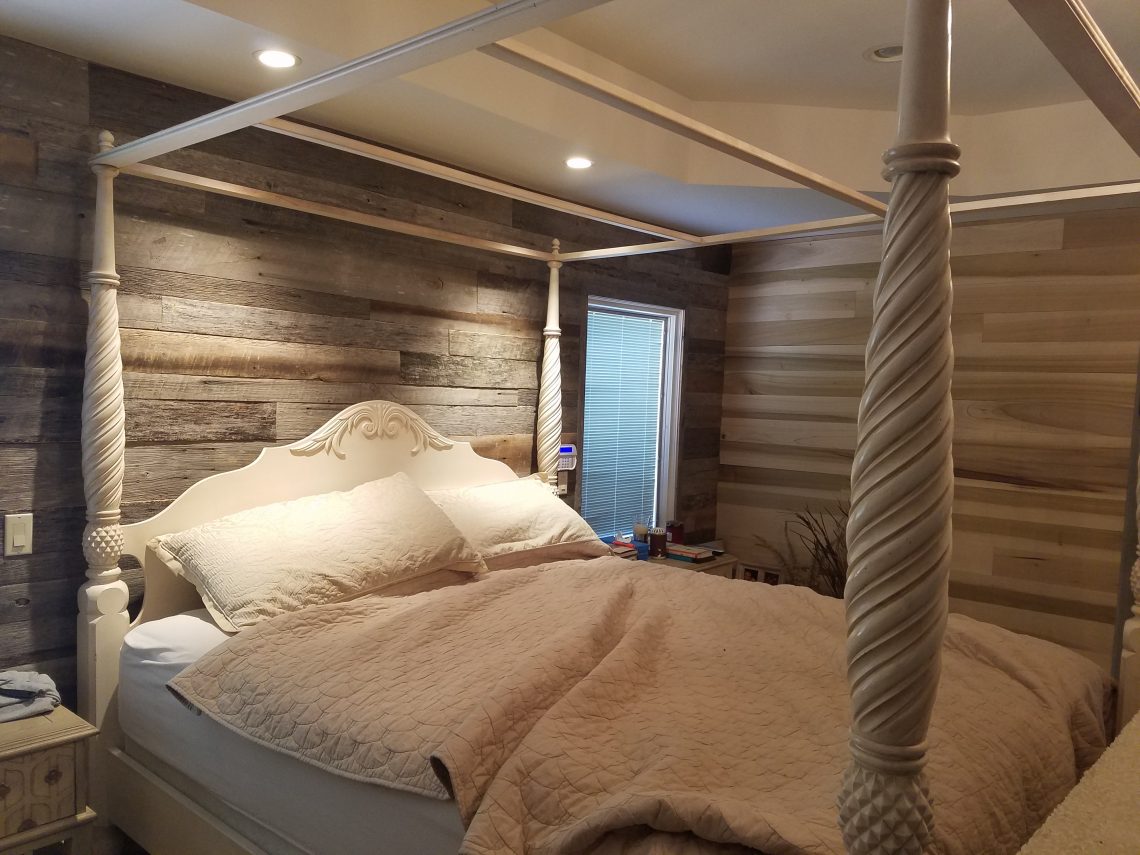 Custom reclaimed wood wall in bedroom
